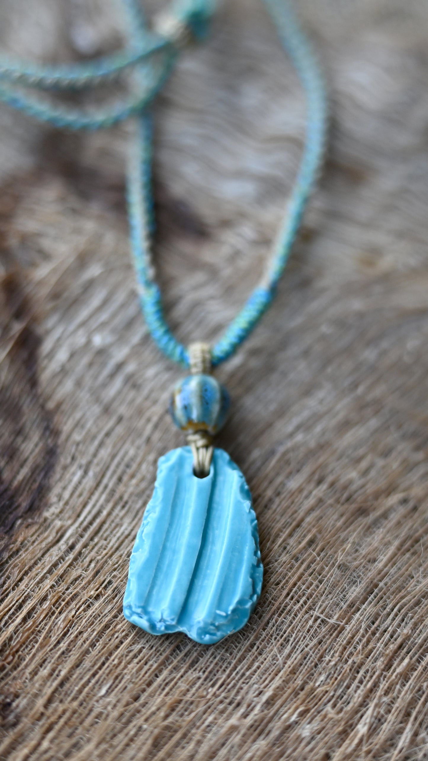NKL-WTR01AQA: Water Design Aqua Ceramic Necklace – Braided Cord