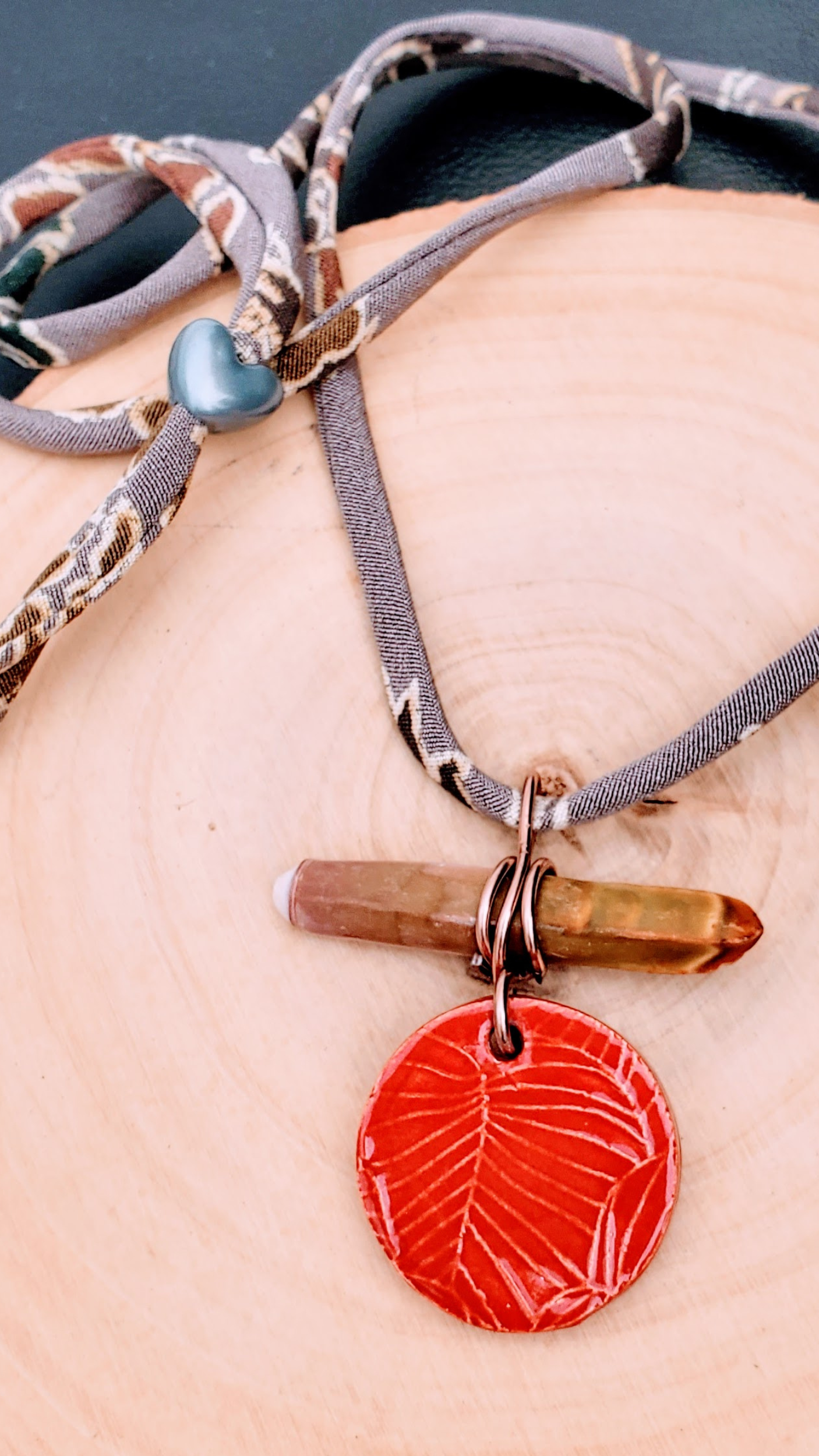 NKL-MON01RED: Monstera Leaf Ceramic Necklace with Sea Urchin Spike and Repurposed Silk Kimono Cord – Red Glaze
