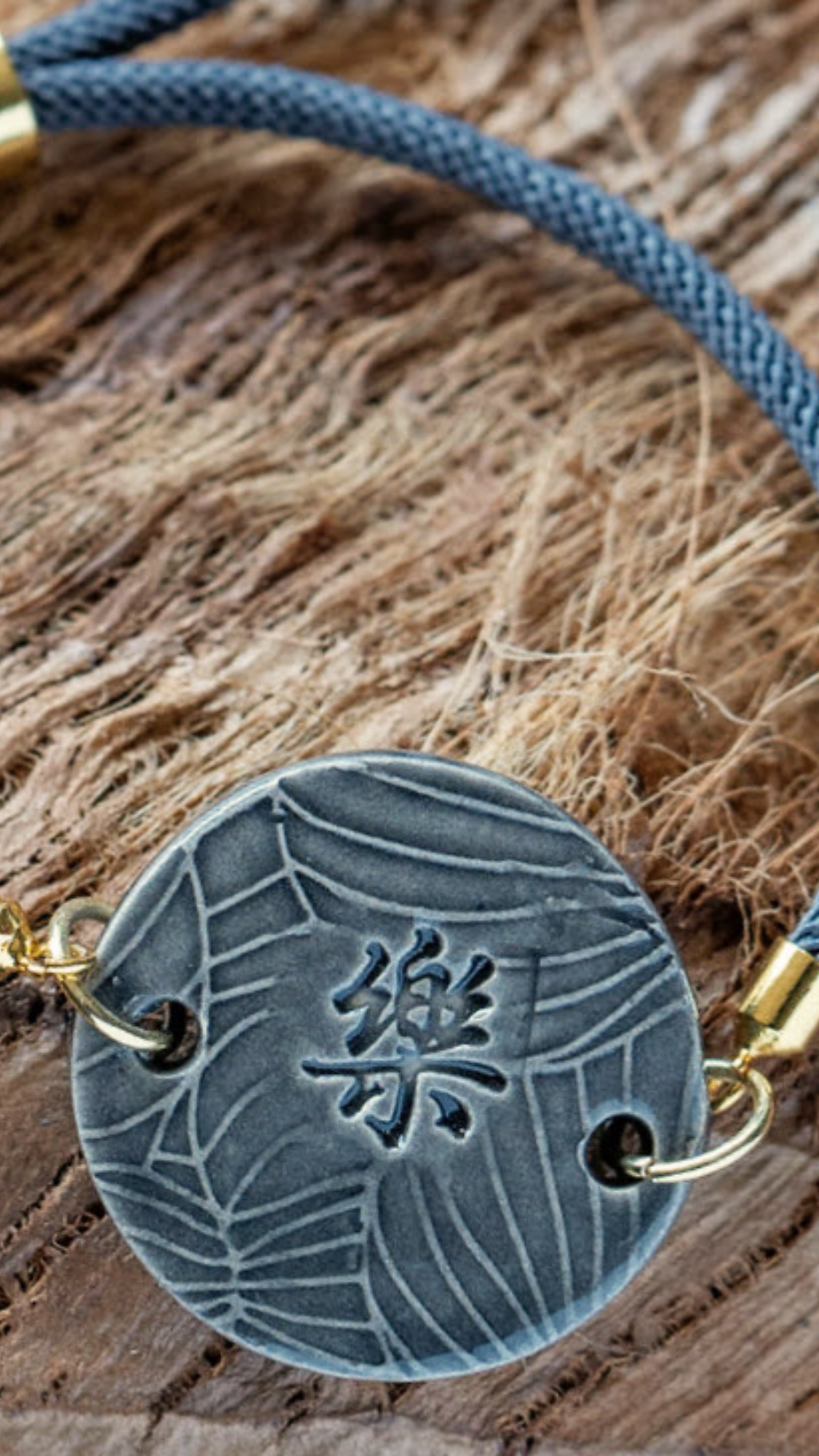 BLT-HAP01GRY: Happiness in Kanji with Monstera Ceramic Bracelet with Adjustable Grey Cable with Gold Tips - Grey glaze