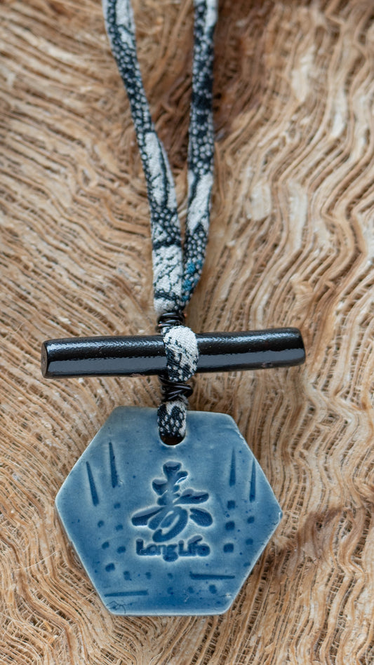 NKL-LLK01ABL: Long Life in Kanji Ceramic Necklace with Black Bamboo and Dark Floral Repurposed Adjustable Silk Kimono Cord - Dark Blue glaze