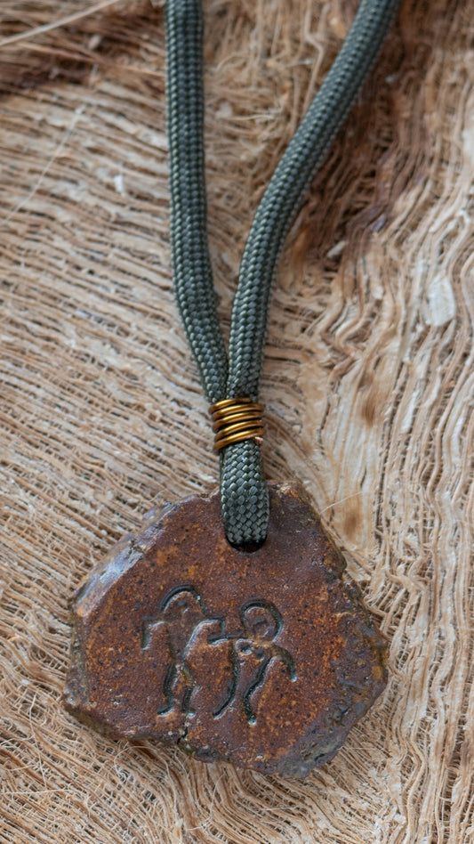 NKL-MWL01DKB: “Lovers” Man and Woman Petroglyph Ceramic Necklace – Dark Brown Glaze