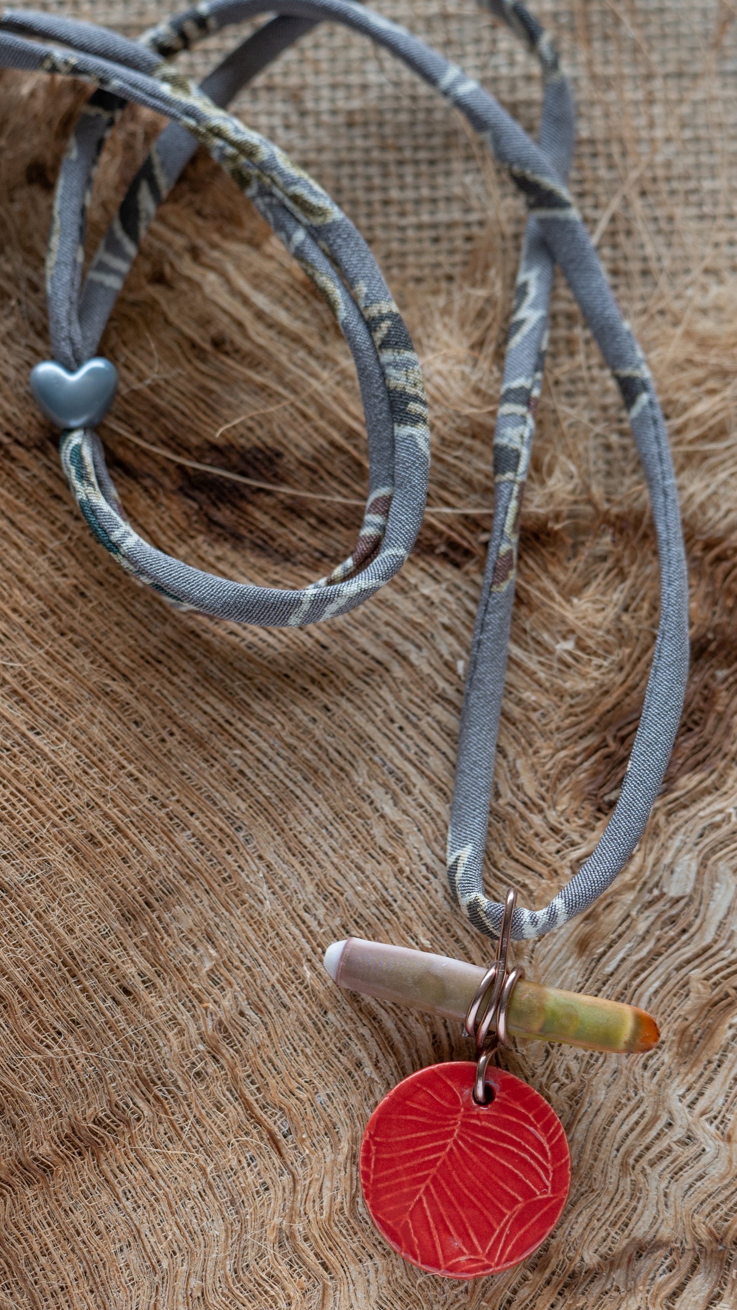NKL-MON01RED: Monstera Leaf Ceramic Necklace with Sea Urchin Spike and Repurposed Silk Kimono Cord – Red Glaze