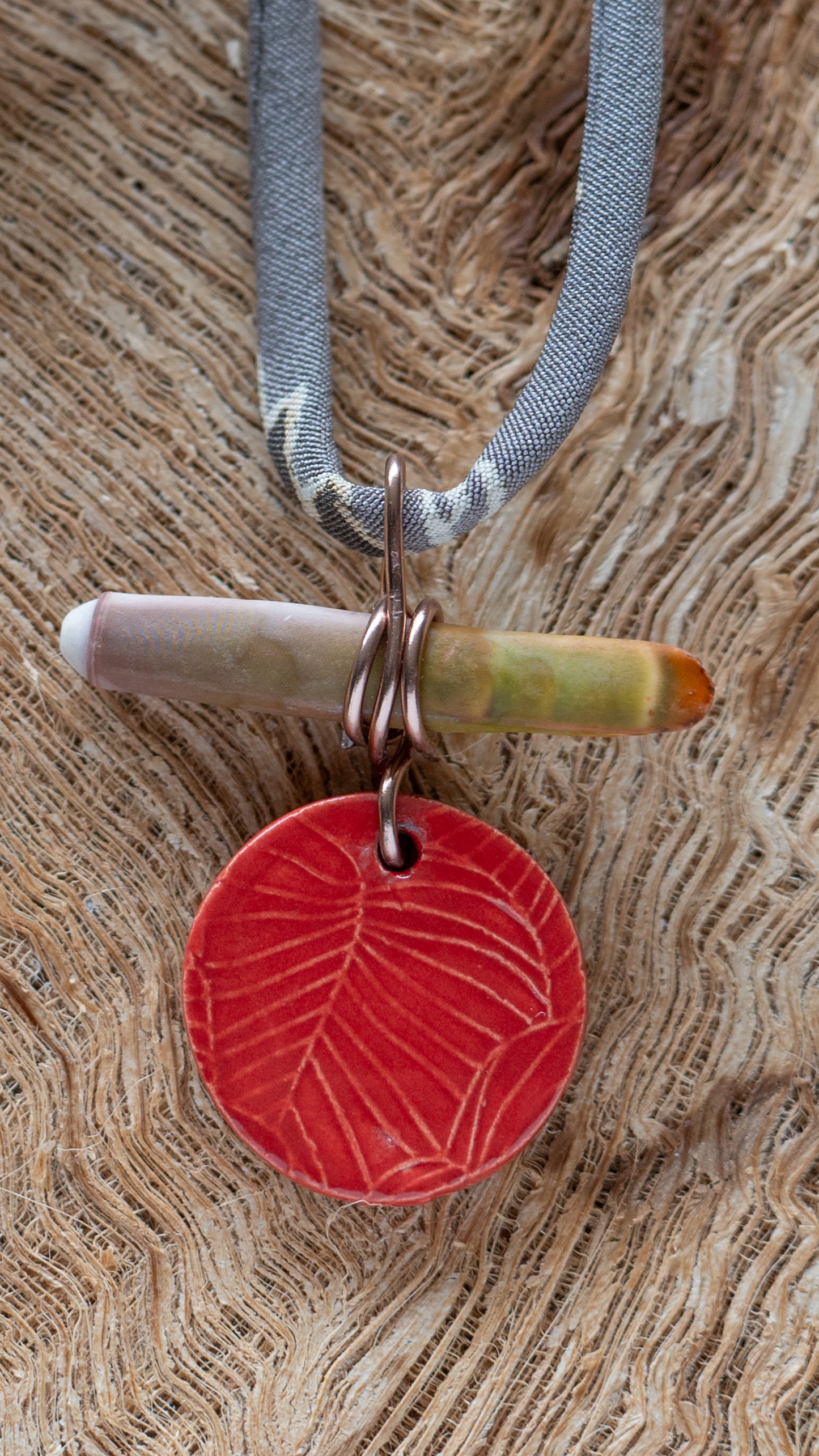 NKL-MON01RED: Monstera Leaf Ceramic Necklace with Sea Urchin Spike and Repurposed Silk Kimono Cord – Red Glaze