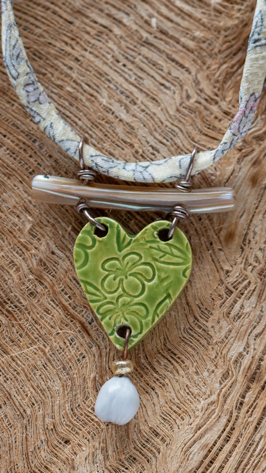 NKL-PLU03GRN: Plumeria Flowers Heart Shaped Ceramic Necklace with Abalone, Job's Tears and Repurposed Silk Kimono Cord – Green Glaze