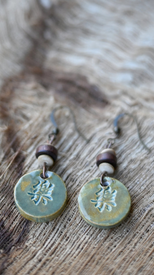 EAR-HAP03BNS: Round Happiness Kanji Ceramic Earrings – Butternut Squash Glaze