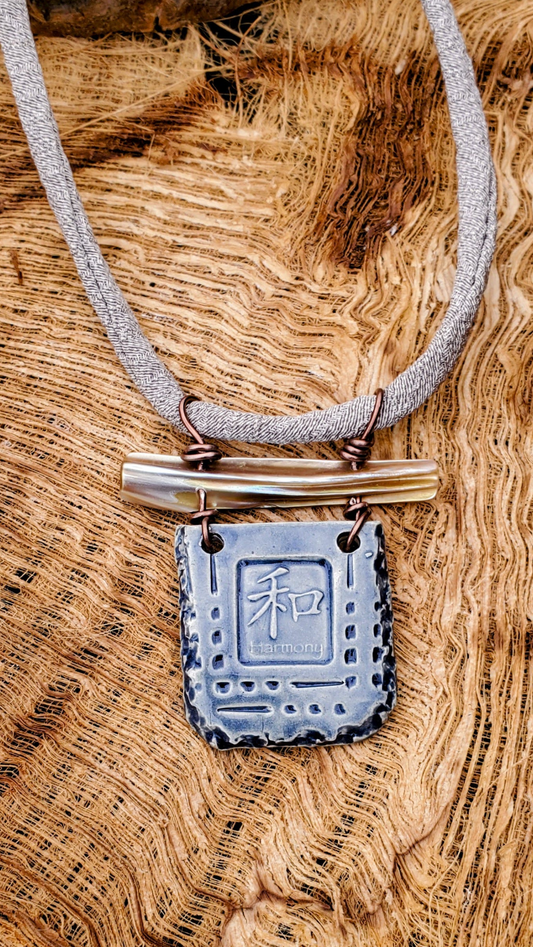 NKL-HRM01BLU: Harmony in Kanji Ceramic Necklace with Abalone and Grey Repurposed Silk Kimono Cord