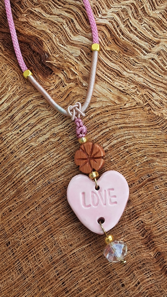 NKL-LOV02PNK: Love Heart Shaped Pink Ceramic Necklace – Braided Silk Cord