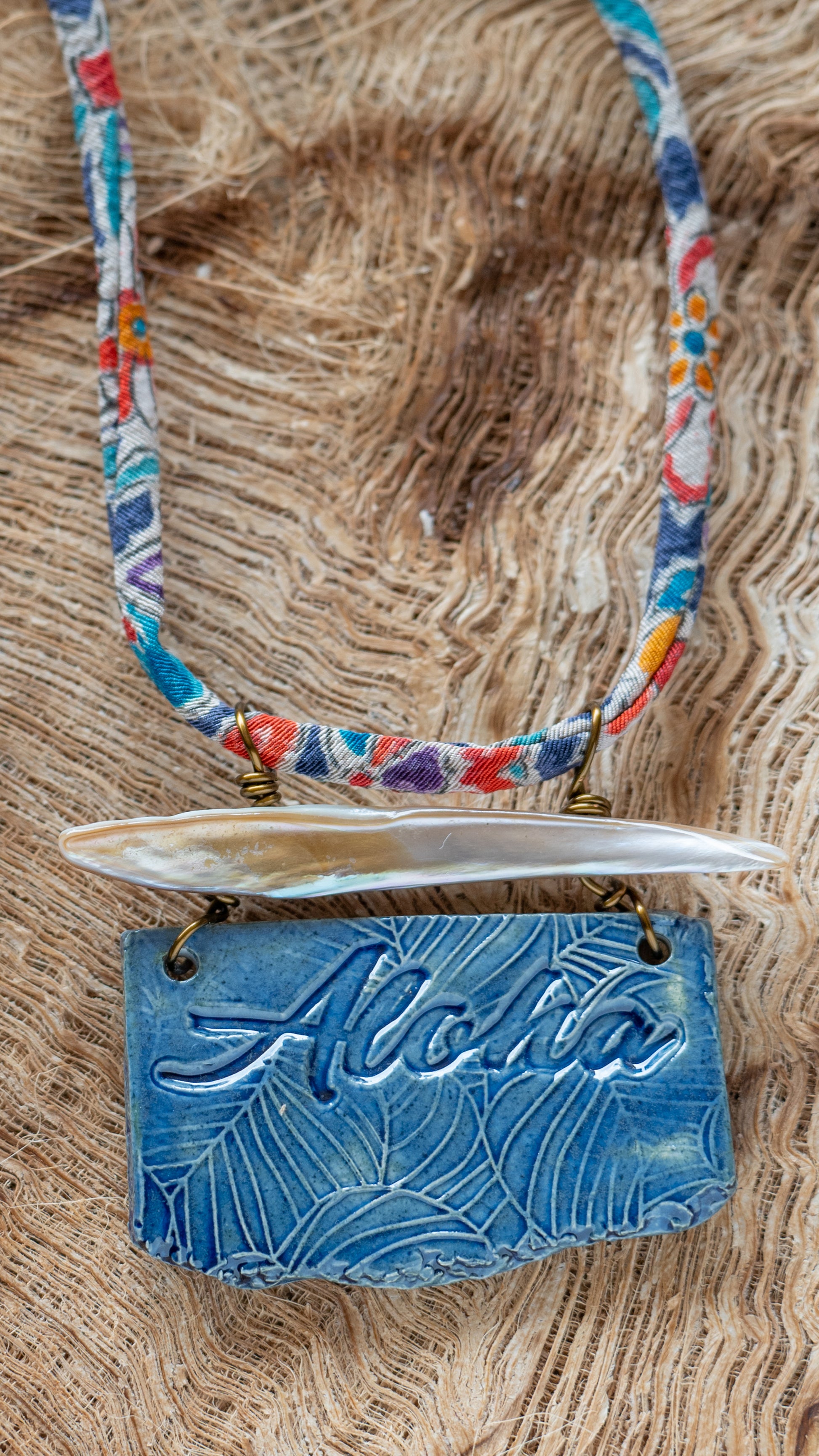 Handcrafted Ceramic Necklace with the word Aloha glazed in dark blue with Abalone and Repurposed Silk Kimono